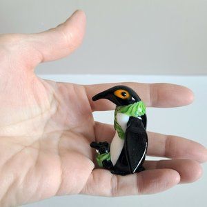 Glass Penguin with baby figurine.